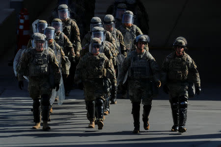 FILE PHOTO: U.S. Military troops return from a test deployment with U.S. Customs and Border Protection agents after conducting a large-scale operational readiness exercise at the San Ysidro port of entry with Mexico in San Diego, California, U.S., January 10, 2019. REUTERS/Mike Blake/File Photo