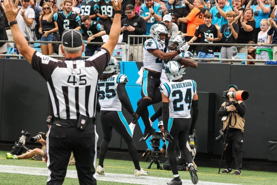 Panthers players celebrate a defensive touchdown by Marquis Haynes after a forced fumble by teammate Frankie Luvu, putting Carolina up 7-0 in the first quarter during the game against the Saints at Bank of America Stadium on Sunday, September 25, 2022 in Charlotte, NC.