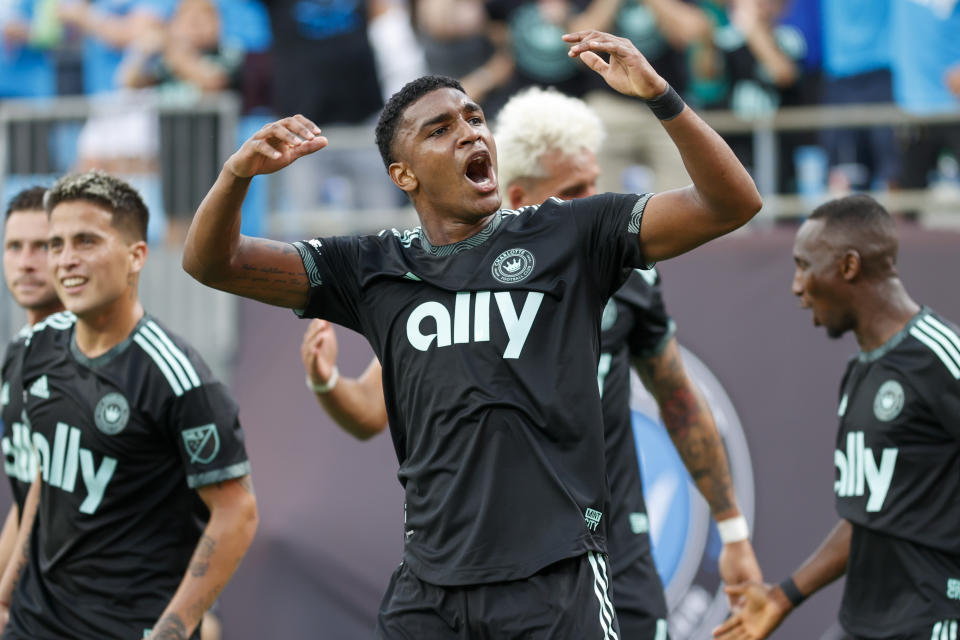 Charlotte FC defender Christian Makoun celebrates after teammate Daniel Rios scored the winning goal in the 85th minute in the second half against the Vancouver Whitecaps in an MLS soccer match in Charlotte, N.C., Sunday, May 22, 2022. (AP Photo/Nell Redmond)