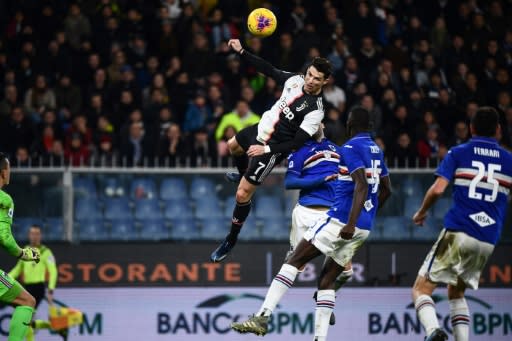 Cristiano Ronaldo leaps to head home Juventus' second in a win at Sampdoria that puts them top of Serie A