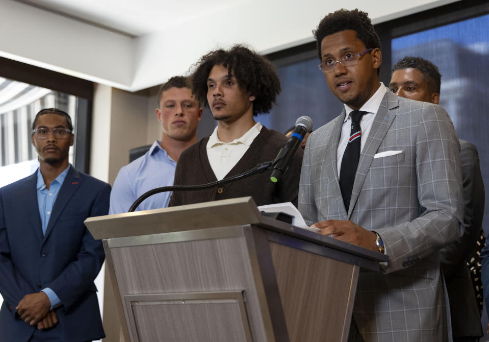 Former Northwestern football player Lloyd Yates speaks July 19 alongside other former players (from left, Warren Miles Long, Tom Carnifax and Simba Short) about the abuse and hazing they say occurred in the program. (Brian Cassella/Chicago Tribune/Tribune News Service via Getty Images)
