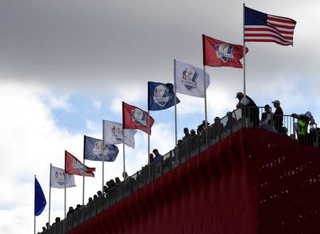 A view of flags on the grand stands on the ninth green during a practice round for the 41st Ryder Cup at Hazeltine National Golf Club. Mandatory Credit: Michael Madrid-USA TODAY Sports