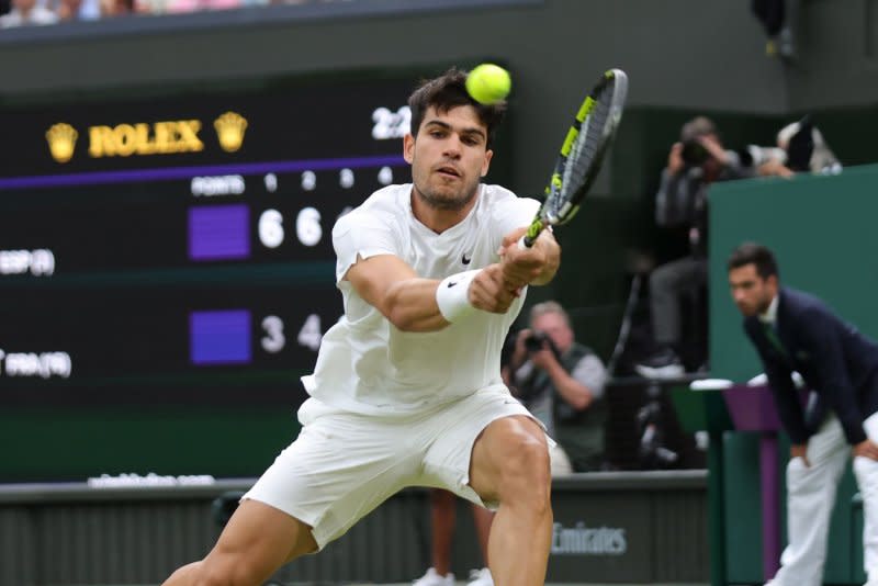 Carlos Alcaraz (pictured) of Spain will meet Daniil Medvedev of Russia in a Wimbledon 2024 men's singles semifinal Friday in London. Photo by Hugo Philpott/UPI