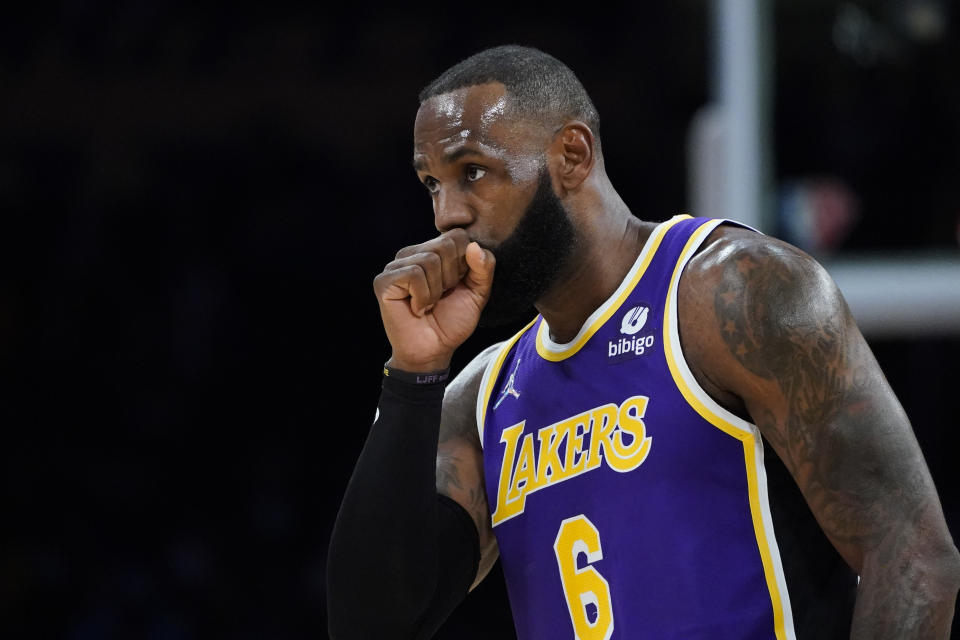 Los Angeles Lakers' LeBron James blows into his fist during the first half of the team's NBA basketball game against the Cleveland Cavaliers on Friday, Oct. 29, 2021, in Los Angeles. (AP Photo/Jae C. Hong)