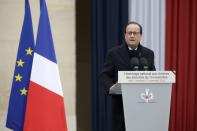 French President Francois Hollande delivers a speech during a ceremony to pay a national homage to the victims of the Paris attacks at Les Invalides monument in Paris, France, November 27, 2015. (REUTERS/Philippe Wojazer)