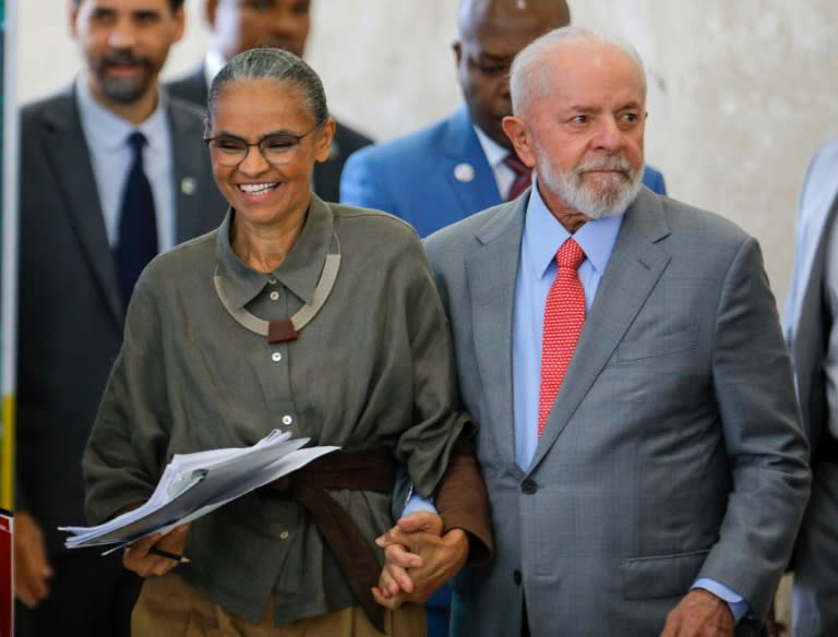 Brazilian President Luiz Inacio Lula da Silva (R) and his Minister of Environment, Mariana Silva, arrive at a ceremony to mark World Environment Day at the Planalto Palace in Brasilia (Sergio Lima)