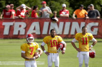 Kansas City Chiefs quarterbacks Aaron Murray (7), Chase Daniel (10) and Alex Smith (11) watch a drill at NFL football training camp Sunday, July 27, 2014, in St. Joseph, Mo. (AP Photo/Charlie Riedel)