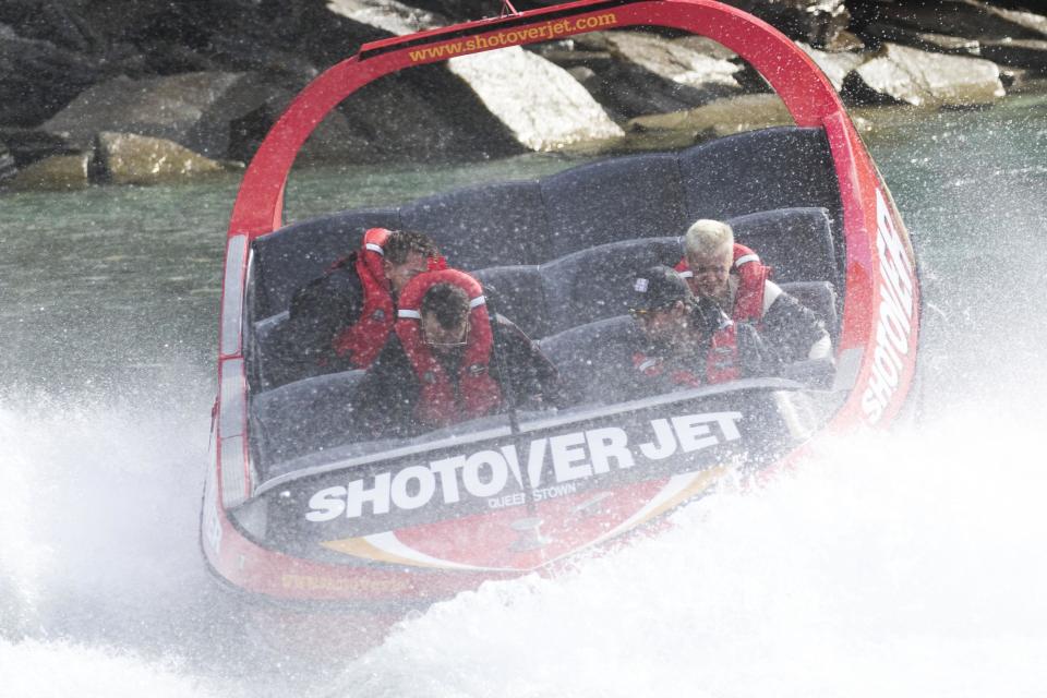 Biebs boards a boat and looks, well bored...