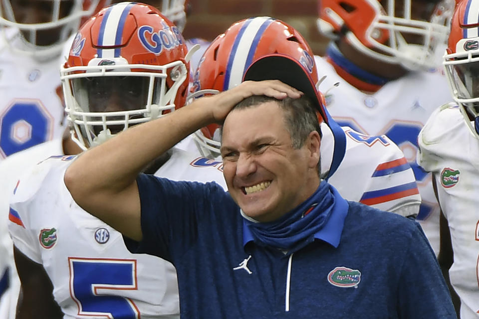 Florida head coach Dan Mullen reacts during the second half of an NCAA college football game against Mississippi in Oxford, Miss., Saturday, Sept. 26, 2020. Mullen was given several more chances Monday, Oct. 12, 2020, to walk back bizarre comments about wanting to pack 90,000 screaming fans inside Florida Field during the coronavirus pandemic. He declined each of them, brushing aside criticism and insisting he's focused on defending national champion LSU. (AP Photo/Thomas Graning)