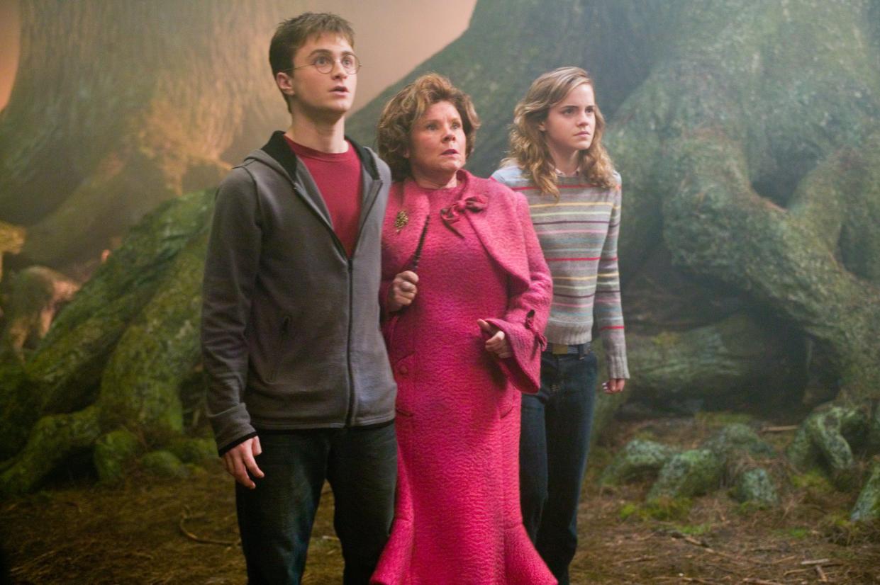 Daniel Radcliffe as Harry Potter; Imelda Staunton as Dolores Umbridge & Emma Watson as Hermione Granger in Harry Potter and the Order of the Phoenix. (Warner Bros.)
