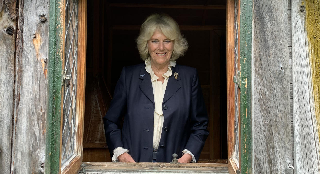 Undated handout photo issued by Clarence House of the Duchess of Cornwall at Birkhall in Scotland, inside a Wendy House originally built on the estate in 1935 for the then Princess Elizabeth and Princess Margaret.