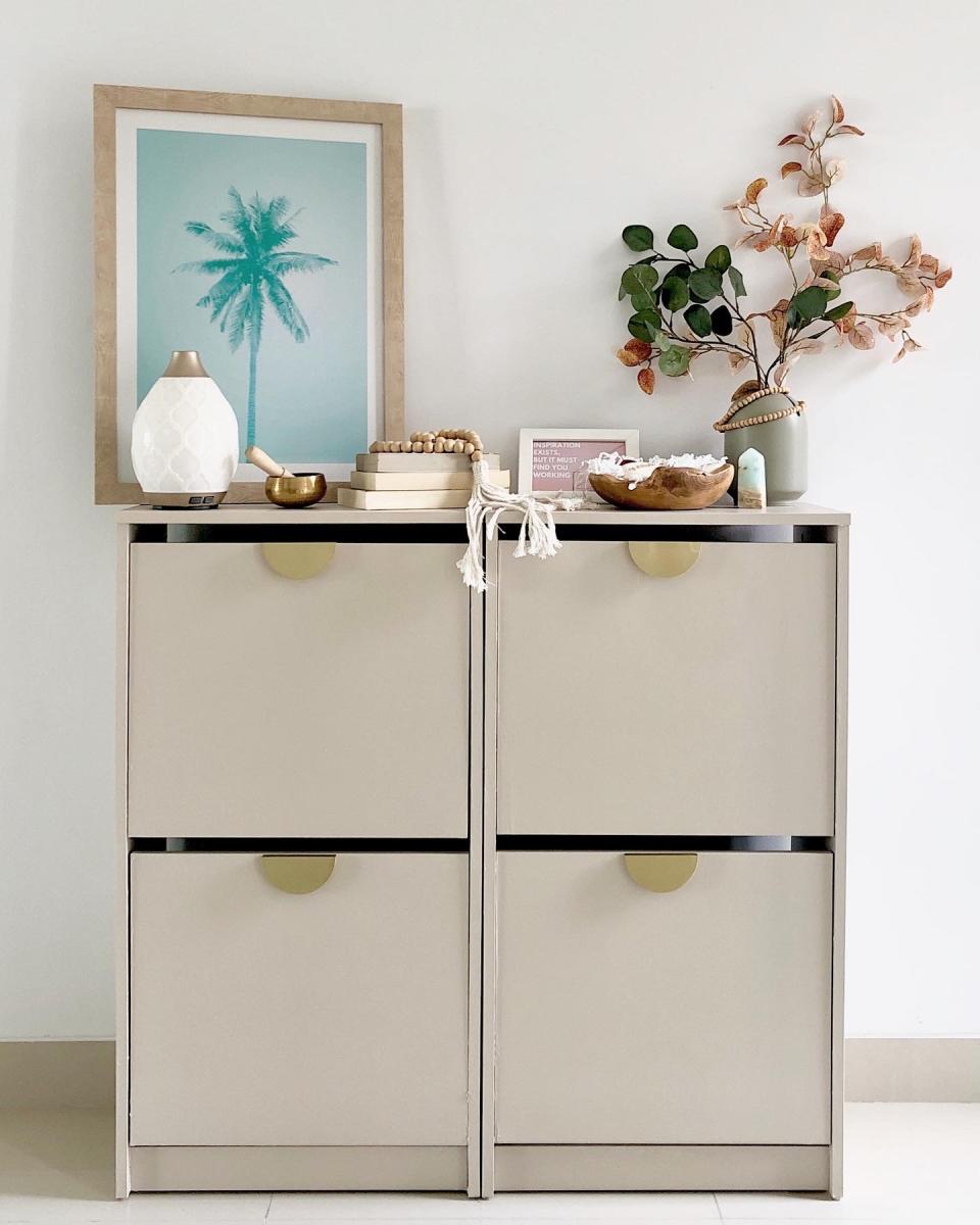 beige square cabinets with gold handles