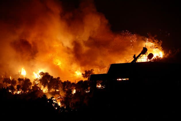 A picture taken on August 3, 2021 shows flames rising from a fire spreading in the Aegean coast city of Oren, near Milas (Photo: STR via Getty Images)