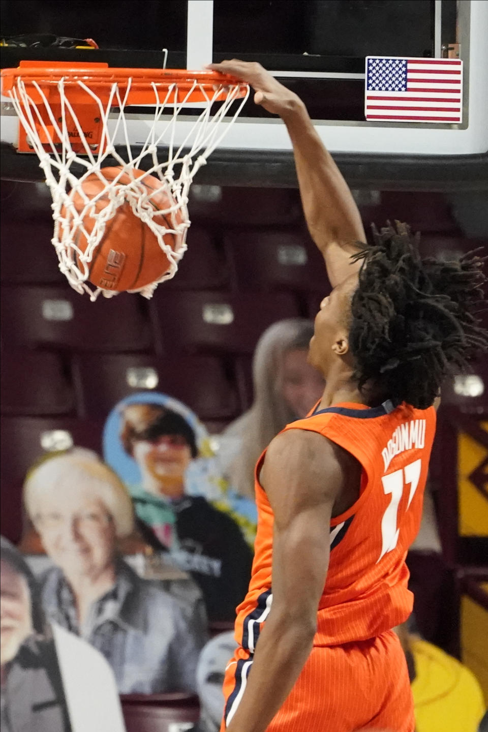 Illinois' Ayo Dosunmu (11) dunks against Minnesota in the first half of an NCAA college basketball game, Saturday, Feb. 20, 2021, in Minneapolis. (AP Photo/Jim Mone)