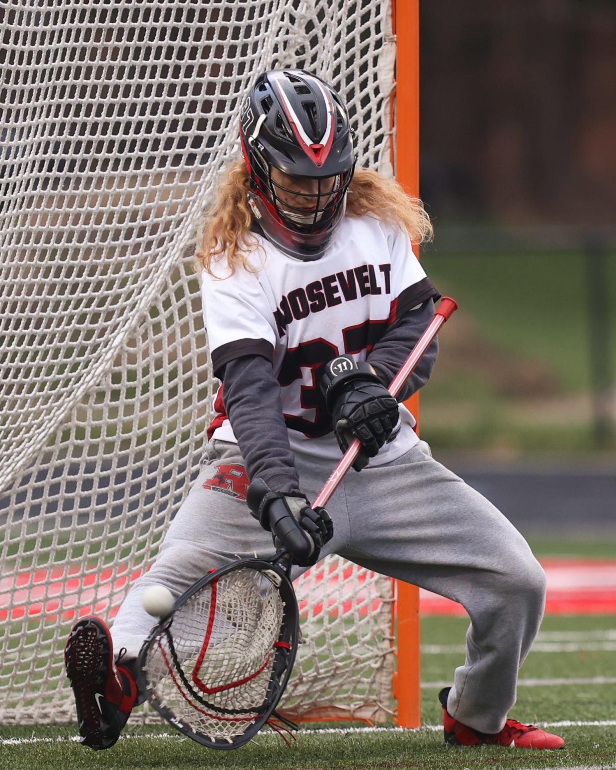 Kent Roosevelt senior goalie Brendan Cramer goes to stop a ball during Tuesday night's game against the Brecksville-Broadview Heights Bees at Roosevelt Stadium.