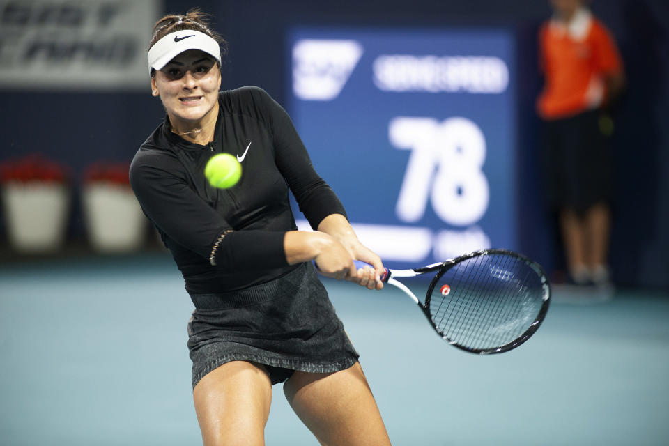 Bianca Andreescu, of Canada, returns a shot to Angelique Kerber, of Germany, during the Miami Open tennis tournament Sunday, March 24, 2019, in Miami Gardens, Fla. (AP Photo/Gaston De Cardenas)