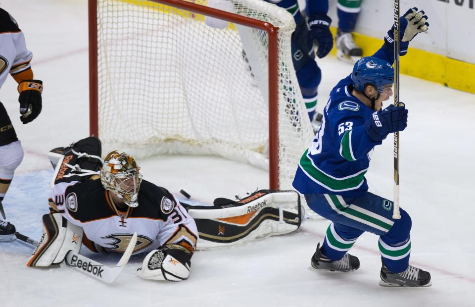 Vancouver Canucks&#39; Bo Horvat, right, celebrates after scoring against Anaheim Ducks goalie Frederik Andersen,during the second period on Nov. 20, 2014. (AP Photo/The Canadian Press, Darryl Dyck)