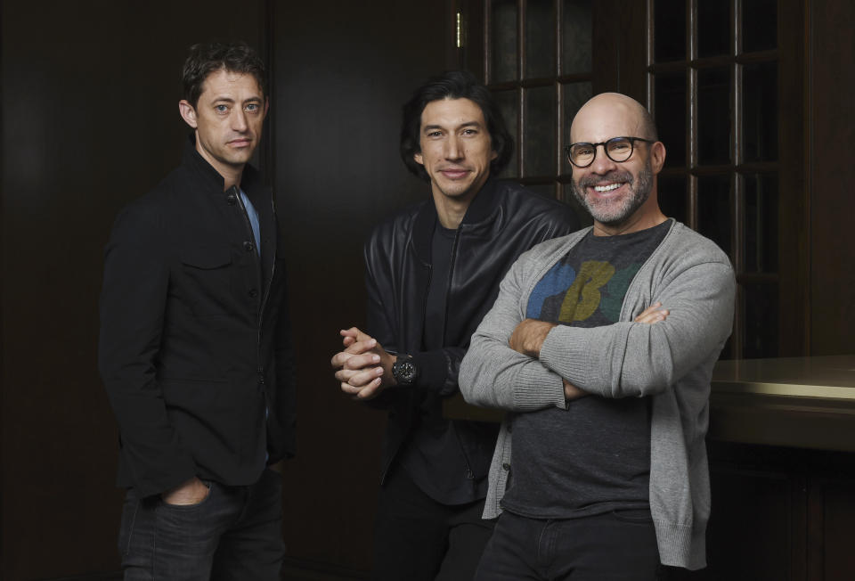 This Sept. 7, 2019 photo shows Scott Z. Burns, right, writer/director of "The Report," posing with former FBI investigator Daniel J. Jones, left, and actor Adam Driver at the Omni King Edward Hotel during the Toronto International Film Festival in Toronto. (Photo by Chris Pizzello/Invision/AP)