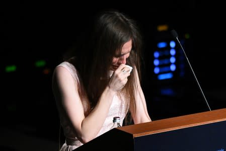 Amanda Knox, who has returned to Italy for the first time since being cleared of the murder of British student Meredith Kercher, cries as she speaks at the Criminal Justice Festival in Modena