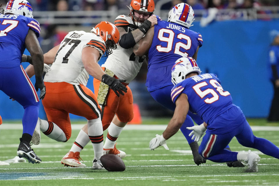Buffalo Bills linebacker Matt Milano (58) recovers a fumble next to Cleveland Browns guard Wyatt Teller (77) during the first half of an NFL football game, Sunday, Nov. 20, 2022, in Detroit. (AP Photo/Paul Sancya)