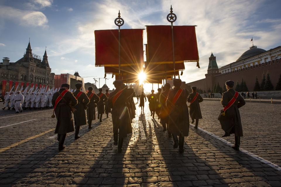 FILE - In this Monday, Nov. 5, 2018 file photo Russian soldiers dressed in Red Army World War II uniforms march during a rehearsal of the Nov. 7 parade in Red Square, in Moscow, Russia. The parade marks the 77th anniversary of a World War II historic parade in Red Square and honored the participants in the Nov. 7, 1941 parade who headed directly to the front lines to defend Moscow from the Nazi forces. (AP Photo/Alexander Zemlianichenko, File)