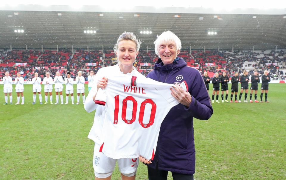 Baroness Sue Campbell presents Ellen White of England with a commemorative shirt marking her 100 appearances for England - GETTY IMAGES