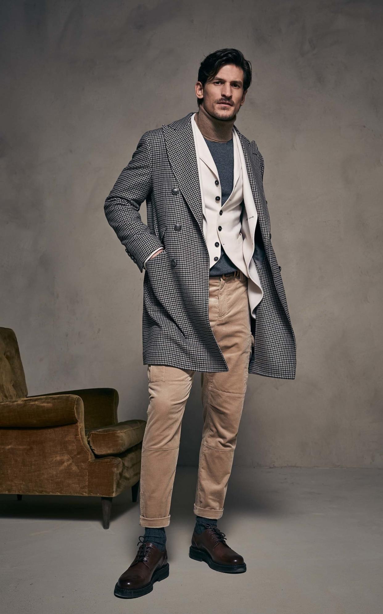 Italian cashmere titan Brunello Cucinelli tweaks the formula of formal suiting with a polo neck and blazer combination