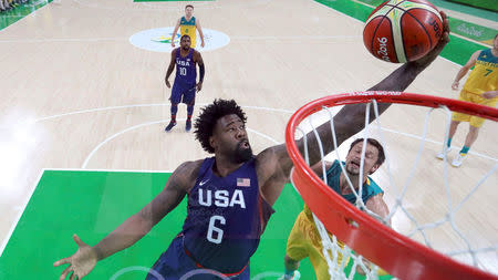 Deandre Jordan (USA) of the USA pulls in a rebound over David Andersen (AUS) of Australia. REUTERS/Mike Ehrmann/Pool