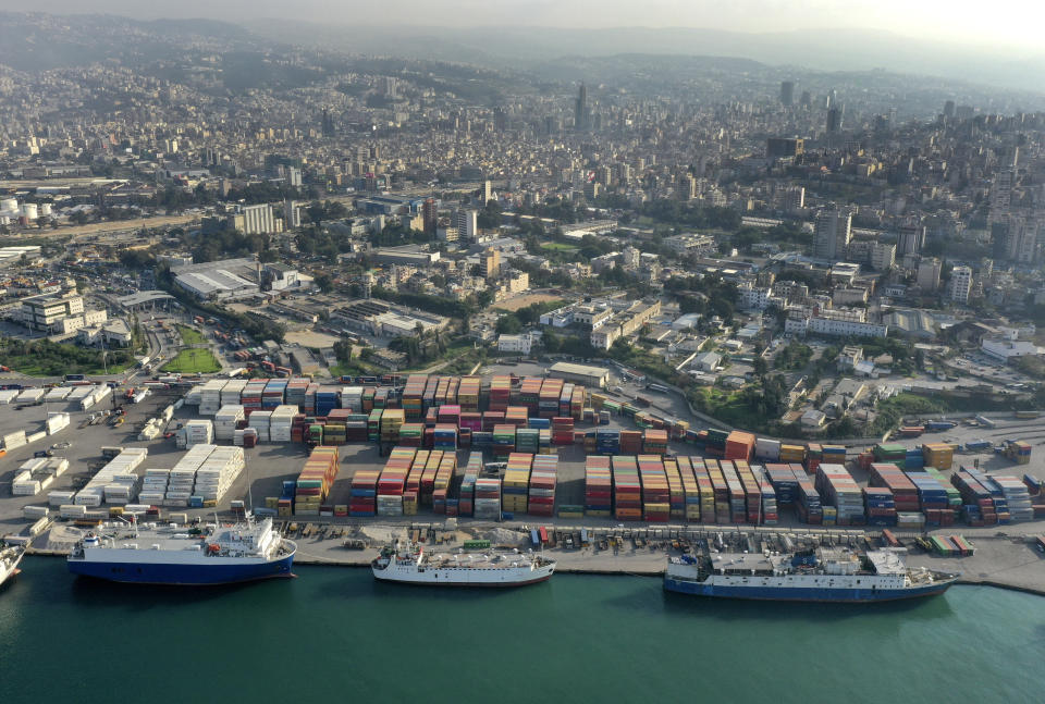 A drone picture shows a general view of containers are piled up at one of Beirut's seaport terminal, in Beirut, Lebanon, Nov. 30, 2018. In recent weeks, Lebanon has been looking for stronger economic relations with eastern countries including China, Iraq and Russia as western countries and oil-rich gulf states have abstained from helping Prime Minister Hassan Diab's government that is backed by Hezbollah and its allies. (AP Photo/Hussein Malla)