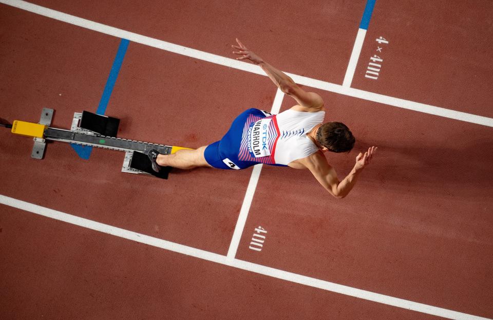 A birds' eye view of Karsten Warholm setting off from the starting blocks.