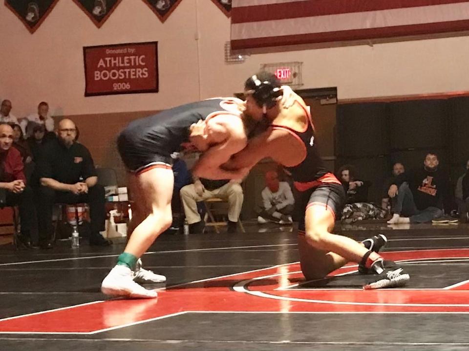 Marion Harding's David Backus, right, competes with Pleasant's Daxton Chase at last year's Sally George Wrestling Invitational at Pleasant.