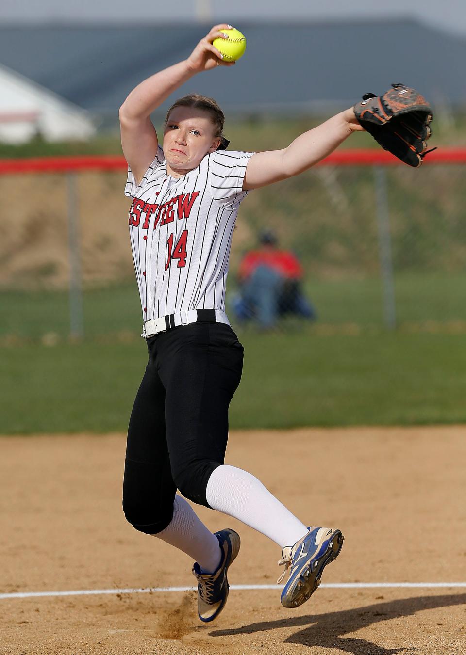 Crestview High School's Chesnie Patton (14) delivers a pitch against Western Reserve High School during high school softball action Tuesday, April 11, 2023. TOM E. PUSKAR/ASHLAND TIMES-GAZETTE