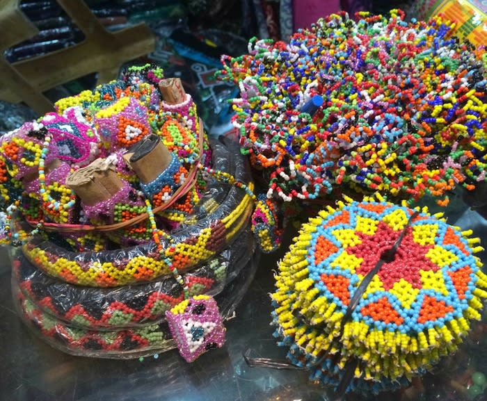 Dayak crafts: Handmade Dayak crafts are varied in range and pricing. The hat, pen cover and key chain adorned in colorful beads are very affordable while the infant carrier and mandau could cost more.