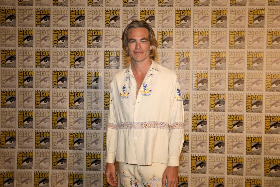 Chris Pine in front of a Comic Con step-and-repeat