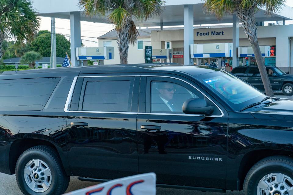 Former President Donald Trump waves to supporters from his motorcade as he returns to Mar-a Lago following his arraignment in New York on April 4, 2023. 