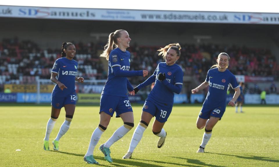 <span>Aggie Beever-Jones receives congratulations after giving <a class="link " href="https://sports.yahoo.com/soccer/teams/chelsea/" data-i13n="sec:content-canvas;subsec:anchor_text;elm:context_link" data-ylk="slk:Chelsea;sec:content-canvas;subsec:anchor_text;elm:context_link;itc:0">Chelsea</a> the lead.</span><span>Photograph: Harriet Lander/Chelsea FC/Getty Images</span>