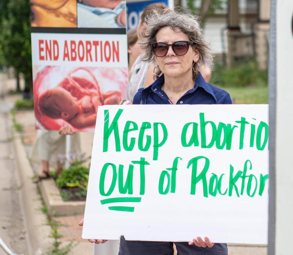 Shirley Poole holds up a anti-abortion sign on Saturday, July 2, 2022, in Rockford.