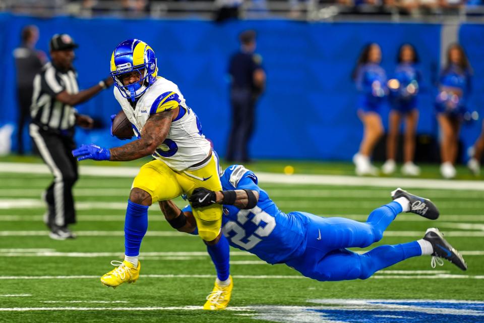 Los Angeles Rams running back Kyren Williams (23) is wrapped up by Detroit Lions cornerback Carlton Davis III (23) during the first half of the Detroit Lions season opener against the Los Angeles Rams at Ford Field in Detroit, on Sunday, Sept. 8. 2024. Kimberly P. Mitchell / USA TODAY NETWORK