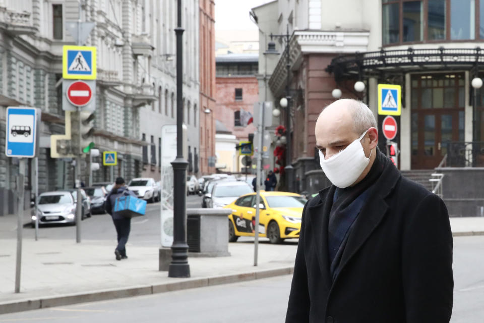 MOSCOW, RUSSIA - MARCH 30, 2020: A man in a face mask in a mostly deserted Myasnitskaya Street in central Moscow during the pandemic of the novel coronavirus (COVID-19). On 29 March 2020, Moscow's authorities issued a stay-at-home order to all people in Moscow regardless of their age, which comes into effect from 30 March 2020. Earlier, the Russian government announced a paid week off work (30 March to 3 April) for employed people and school holidays (21 March - 12 April), while Moscow's authorities ordered the shutdown of restaurants, leisure facilities and other service industry businesses and urged older Muscovites to self-isolate to counter the spread of the novel coronavirus (COVID-19). Sergei Fadeichev/TASS (Photo by Sergei Fadeichev\TASS via Getty Images)