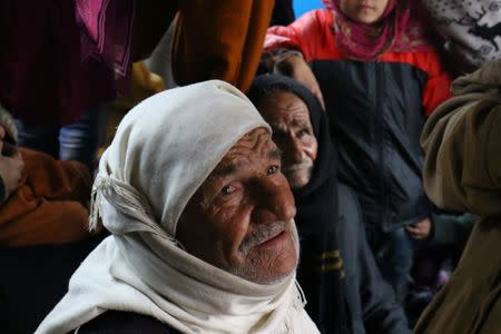 Evacuees from the Shi'ite Muslim villages of al-Foua and Kefraya ride a bus at insurgent-held al-Rashideen in the province of Aleppo, Syria December 22, 2016. REUTERS/Ammar Abdullah