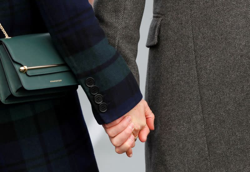 FILE PHOTO: Meghan Markle, and Britain's Prince Harry, meet members of the crowd during a visit to Edinburgh