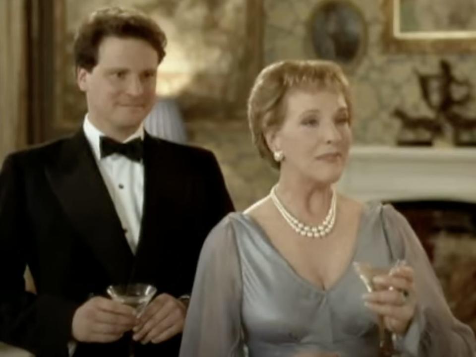 Colin firth holding a martini glass in a suit and bowtie next to Julie Andrews in "Relative Values."