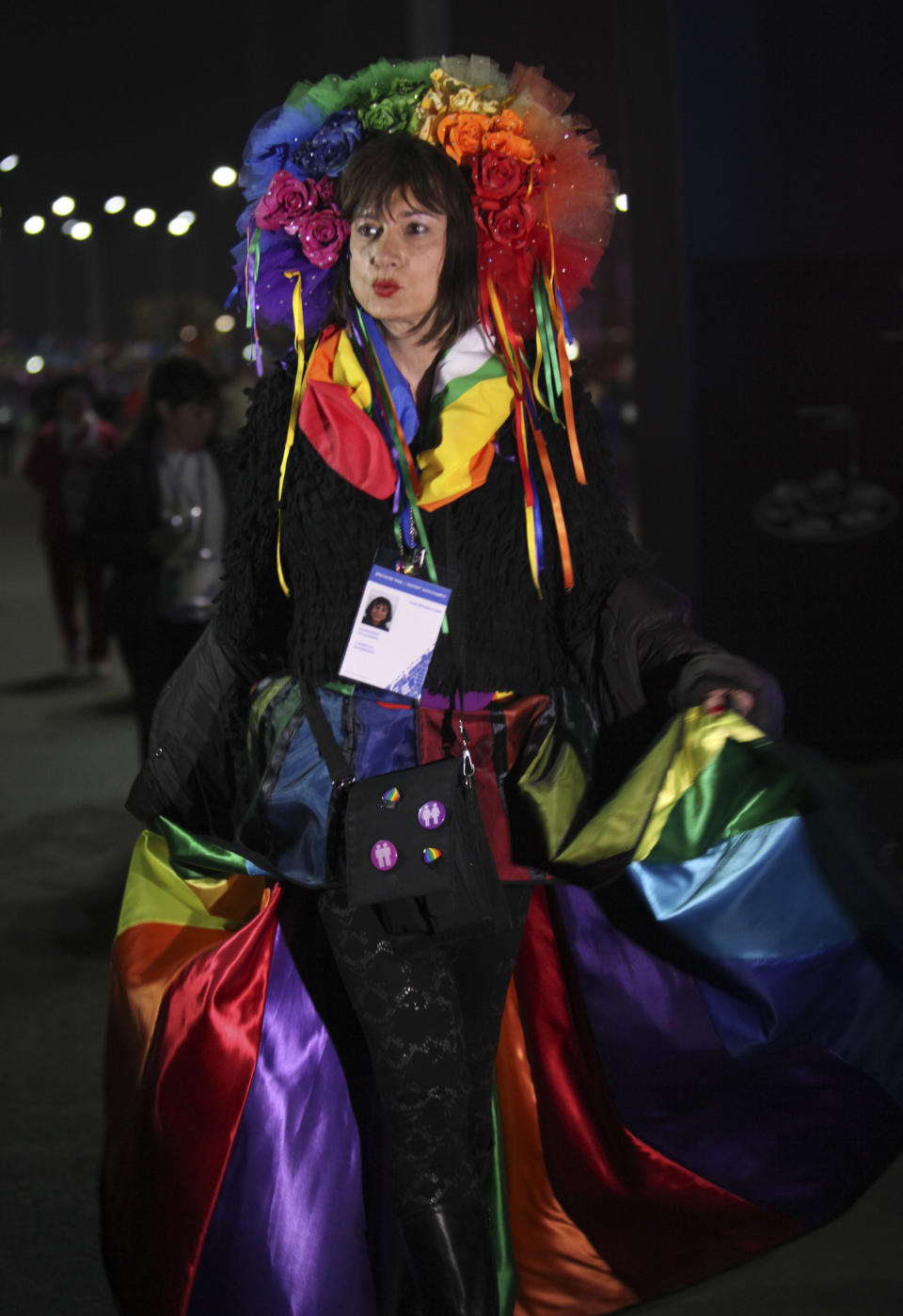 Vladimir Luxuria, a former Communist lawmaker in the Italian parliament and prominent crusader for transgender rights, walks in Olympic Park at the 2014 Winter Olympics, Monday, Feb. 17, 2014, in Sochi, Russia. Luxuria said she was detained by police at the Olympics after being stopped while carrying a rainbow flag that read in Russian: "Gay is OK." Police on Monday denied this happened. (AP Photo/Steve Barker)