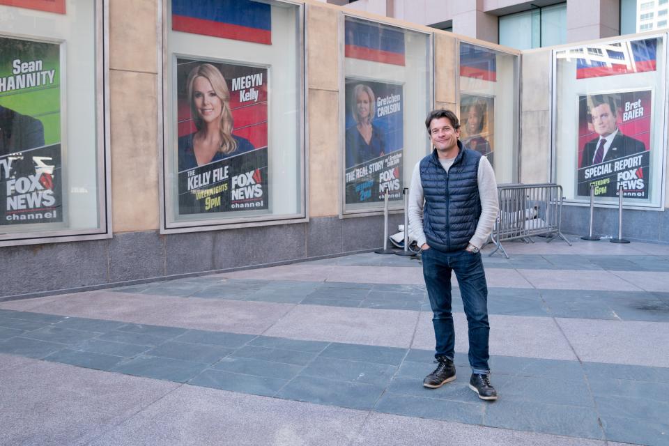 The Los Angeles Times building doubled as the Fox News sets in midtown Manhattan. Here, Ricker appears before the stand-in edifice.