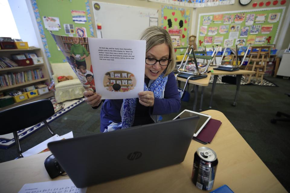 LOUISVILLE, KENTUCKY - APRIL 15:  Joanne Collins Brock , a second grade teacher at St Francis School (Goshen) , teaches online in her empty classroom on April 15, 2020 in Goshen, Kentucky.  Brock has been teaching daily online to her students because of the closure of schools in Kentucky due to the Coronavirus (COVID-19) pandemic. (Photo by Andy Lyons/Getty Images)