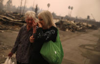 <p>Residents walk through the fire damaged Journey’s End Mobile Home Park on Oct. 9, 2017 in Santa Rosa, Calif. (Photo: Justin Sullivan/Getty Images) </p>