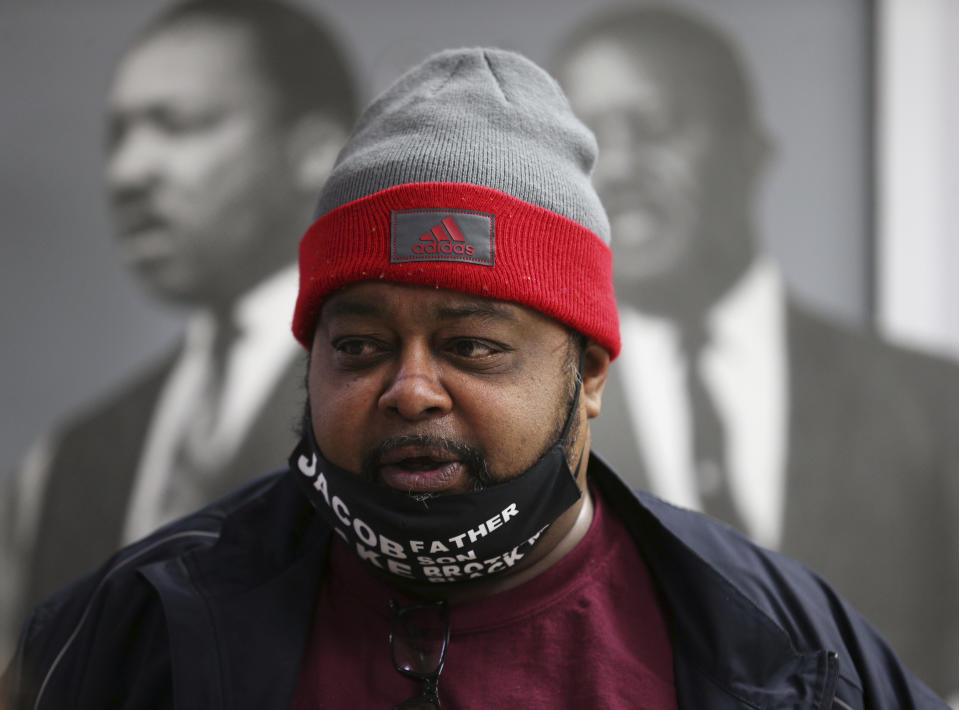 Jacob Blake Sr. speaks to the media at Rainbow/PUSH in Chicago, Tuesday, Jan. 5, 2021, after it was announced that the police officer who shot Blake's son Jacob Blake Jr. multiple times in the back in August 2020, in Kenosha, Wis., would not face criminal charges. In the background are photos of Martin Luther King Jr., left, and fellow activist and Baptist minister Ralph Abernathy. (Terrence Antonio James/Chicago Tribune via AP)