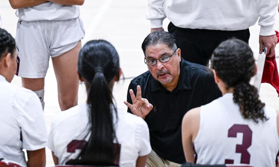 Mt. Whitney's Head Coach Louie Perez directs his team against Porterville in an East Yosemite League high school girls basketball game Tuesday, January 9, 2024.