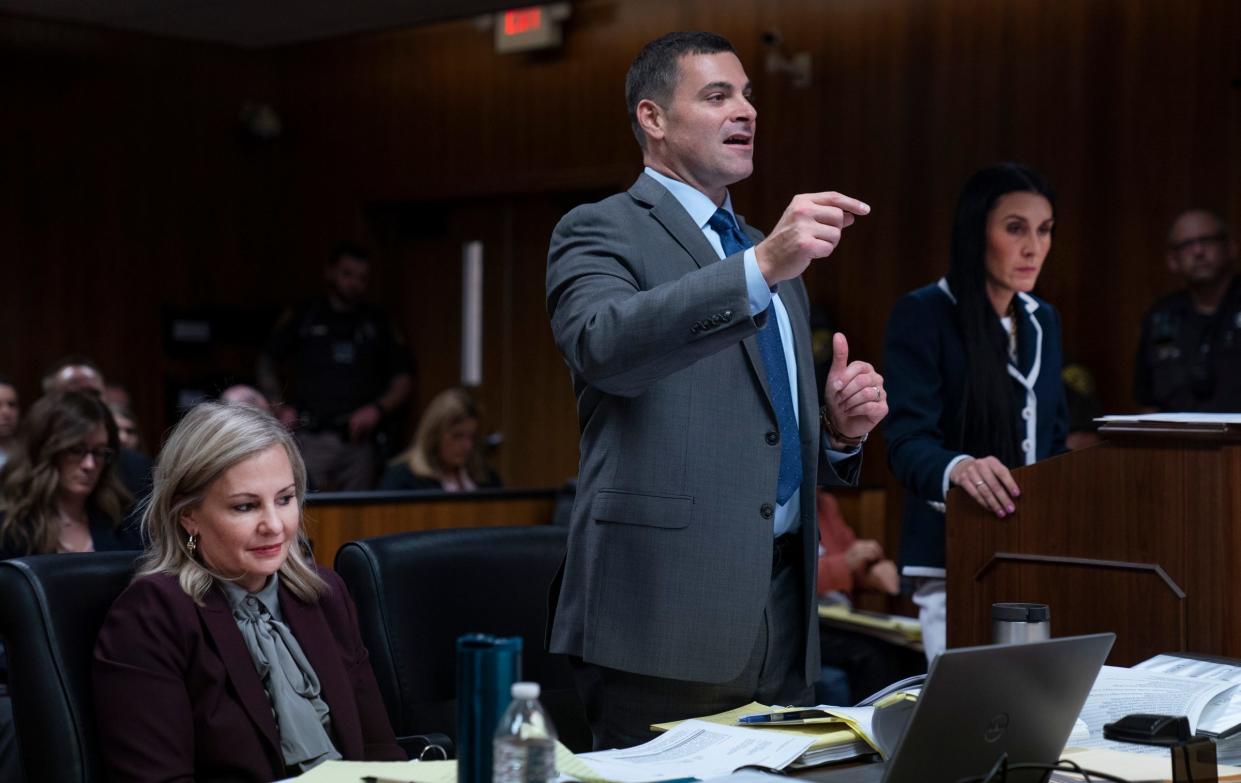 Oakland County Prosecutor Karen McDonald left, listens as Assistant Oakland County Prosecutor Marc Keast, makes an objection to defense attorney Paulette Michel Loftin's questioning of forensic psychiatrist Dr. Lisa Anacker as Ethan Crumbley appears in the Oakland County Courtroom of Kwame Rowe, on Friday, Aug. 18, 2023, in Pontiac, Mich. The Oakland County Prosecutors are making their case that Crumbley, a teenager, should be sentenced to life without parole for killing four students at Oxford High School in 2021.