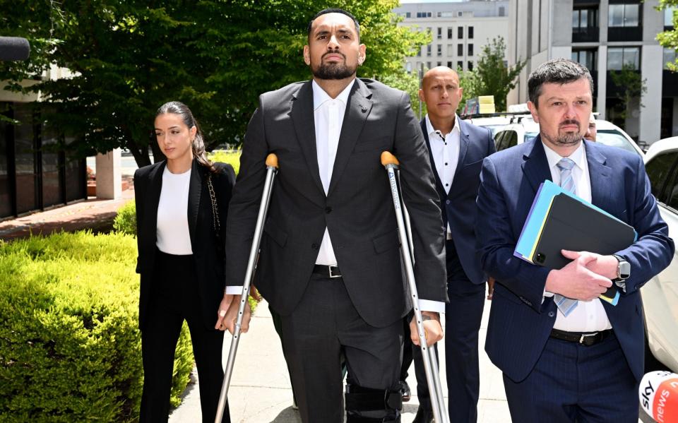 Nick Kyrgios appears in the Canberra Magistrates Court on crutches